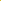 The Micro Wale Corduroy - Golden Kiwi by Super Cheap Fabrics features a textured yellow appearance, ideal for winter clothing. Its layered creases and shadows highlight the thick diagonal ribbed texture, adding depth to the vibrant 142cm-wide material.