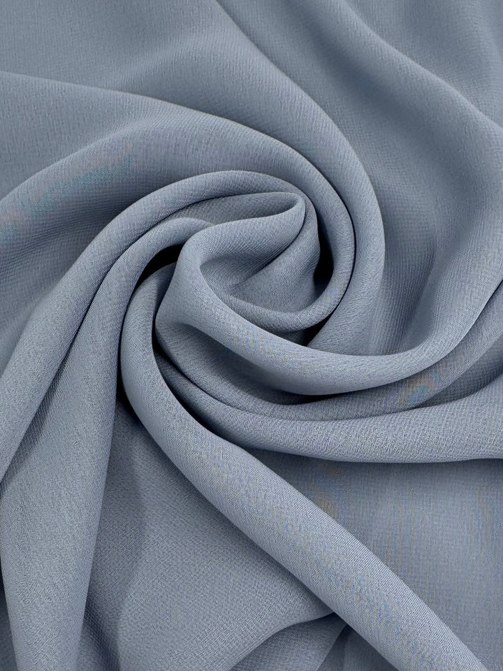 Super Cheap Fabrics’ Hi-Multi Chiffon - Blue Fog (148cm) is a soft, lightweight fabric with a smooth, subtly textured surface and elegant drape—ideal for crafting floaty tops.