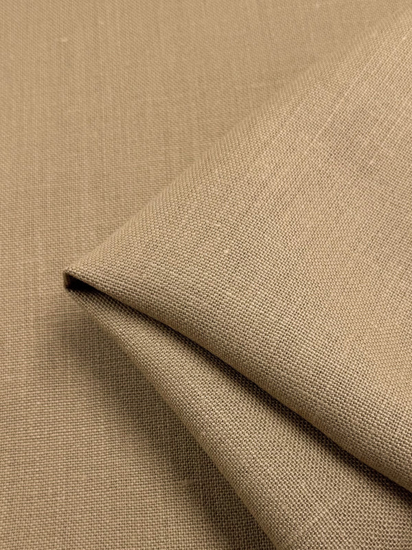 A close-up of the Pure Linen - Iced Coffee by Super Cheap Fabrics reveals neatly folded coarse-textured heavy weight linen. The woven pattern and natural color highlight its breathable qualities, all within a 143cm width.