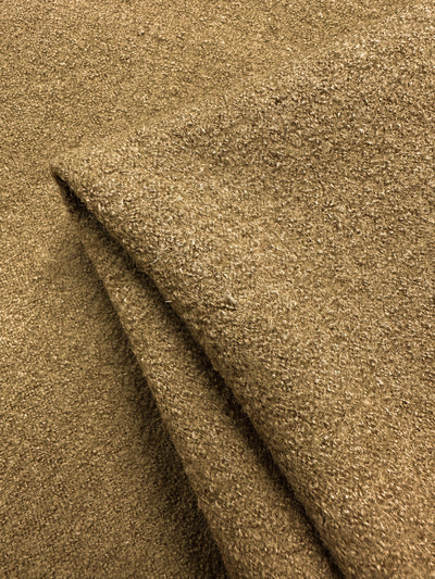Close-up of a folded piece of the 147cm Boiled Wool in Oak from Super Cheap Fabrics, showcasing its luxurious, heavy weight textured surface with visible fibers, exuding warmth and comfort.
