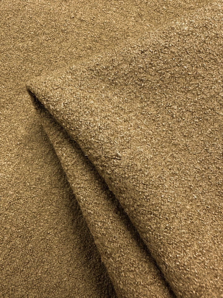Close-up of a folded piece of the 147cm Boiled Wool in Oak from Super Cheap Fabrics, showcasing its luxurious, heavy weight textured surface with visible fibers, exuding warmth and comfort.