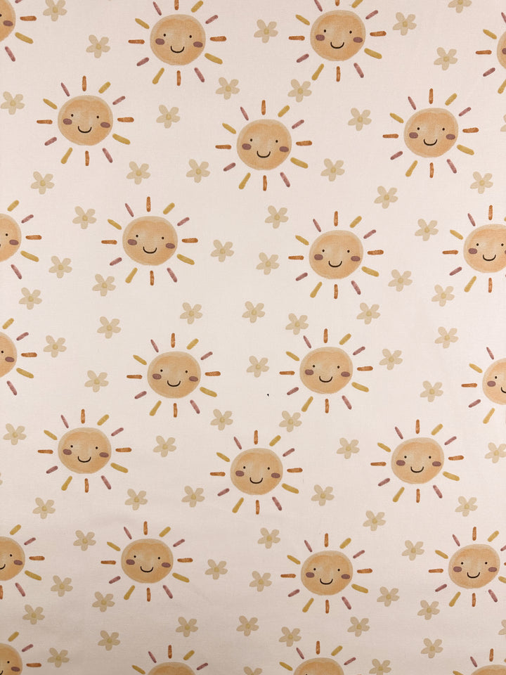 The Cotton Duck - Sunny fabric by Super Cheap Fabrics features smiling suns with friendly faces and small flowers on a light cotton backdrop. Its medium weight is perfect for adding cheer to any space. Width: 112cm.