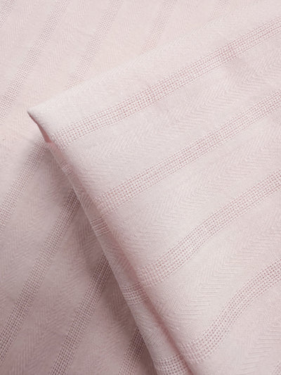 Close-up of Super Cheap Fabrics’ Textured Cotton - Silver Pink - 143cm, featuring subtle striped patterns with a mix of smooth and raised lines for an elegant look.