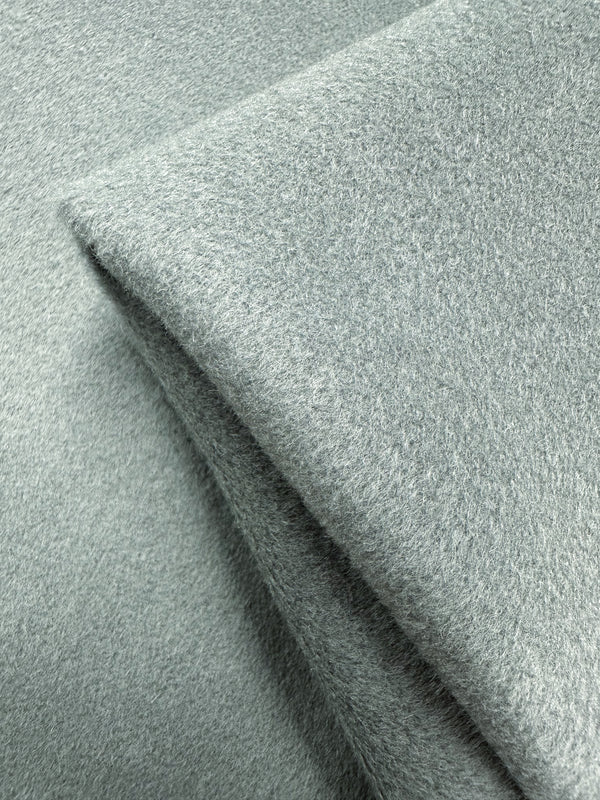 Close-up of the Deadstock Wool Cashmere by Super Cheap Fabrics in Iceberg Green. This 150cm fabric is luxuriously soft and thick, with a plush, slightly fuzzy texture evoking high-quality Italian craftsmanship.