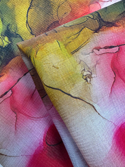 Close-up of a vibrant watercolor design on breathable material, featuring pink, red, yellow, and green hues with organic shapes. Ideal for luxury projects. Designer Cotton - Catalina - 150cm by Super Cheap Fabrics.