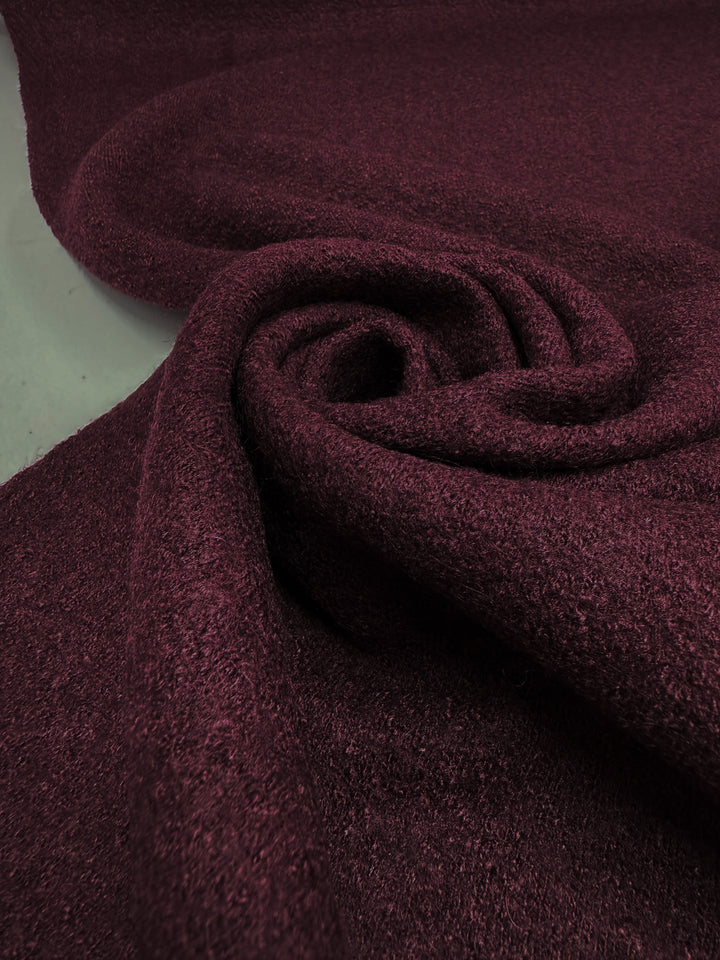 A close-up of Super Cheap Fabrics' Boiled Wool - Port Royale - 147cm, showcasing its soft, textured surface swirled in a circular pattern.
