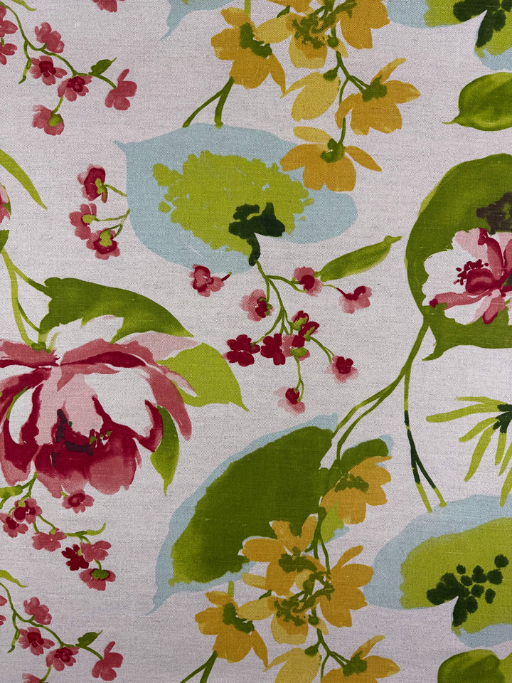Super Cheap Fabrics' Pure Linen - Garden Reverie - 150cm features watercolor floral patterns in green, yellow, red, and pink with blue accents on light beige—part of the elegant Garden Reverie collection.